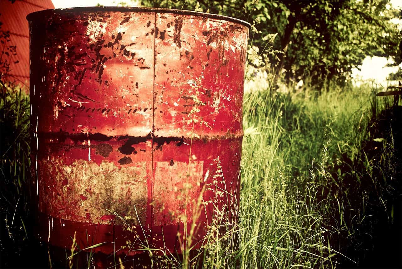 A red old barrel left over from debris cleanup.